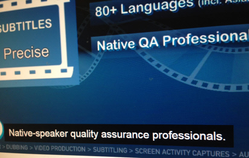 Online social media video with closed captioning and subtitling enabled. Caption with black background over image reads, "Native-speaker quality assurance professionals."
